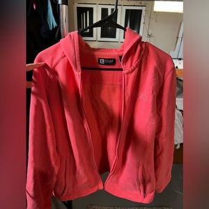 Cute jacket. It’s like a pink/orange, very bright.